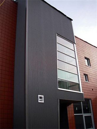 Toronto building entryway with black architectural aluminum siding