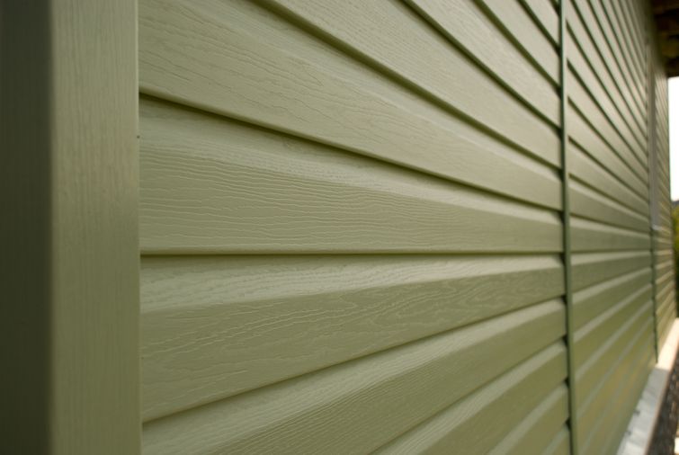 Up-close view of olive-coloured aluminum siding